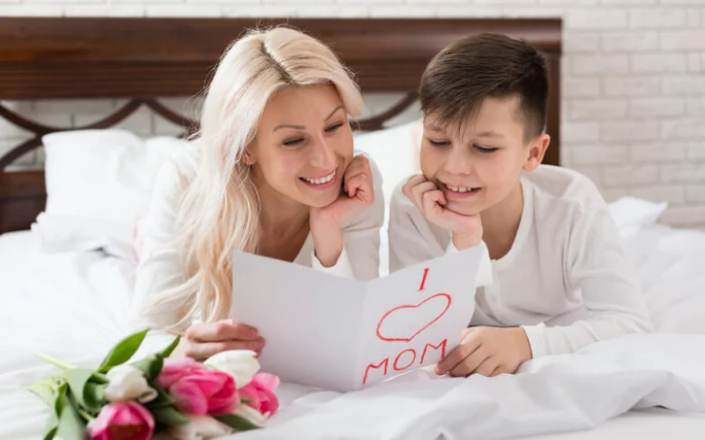 Mother and son reading card